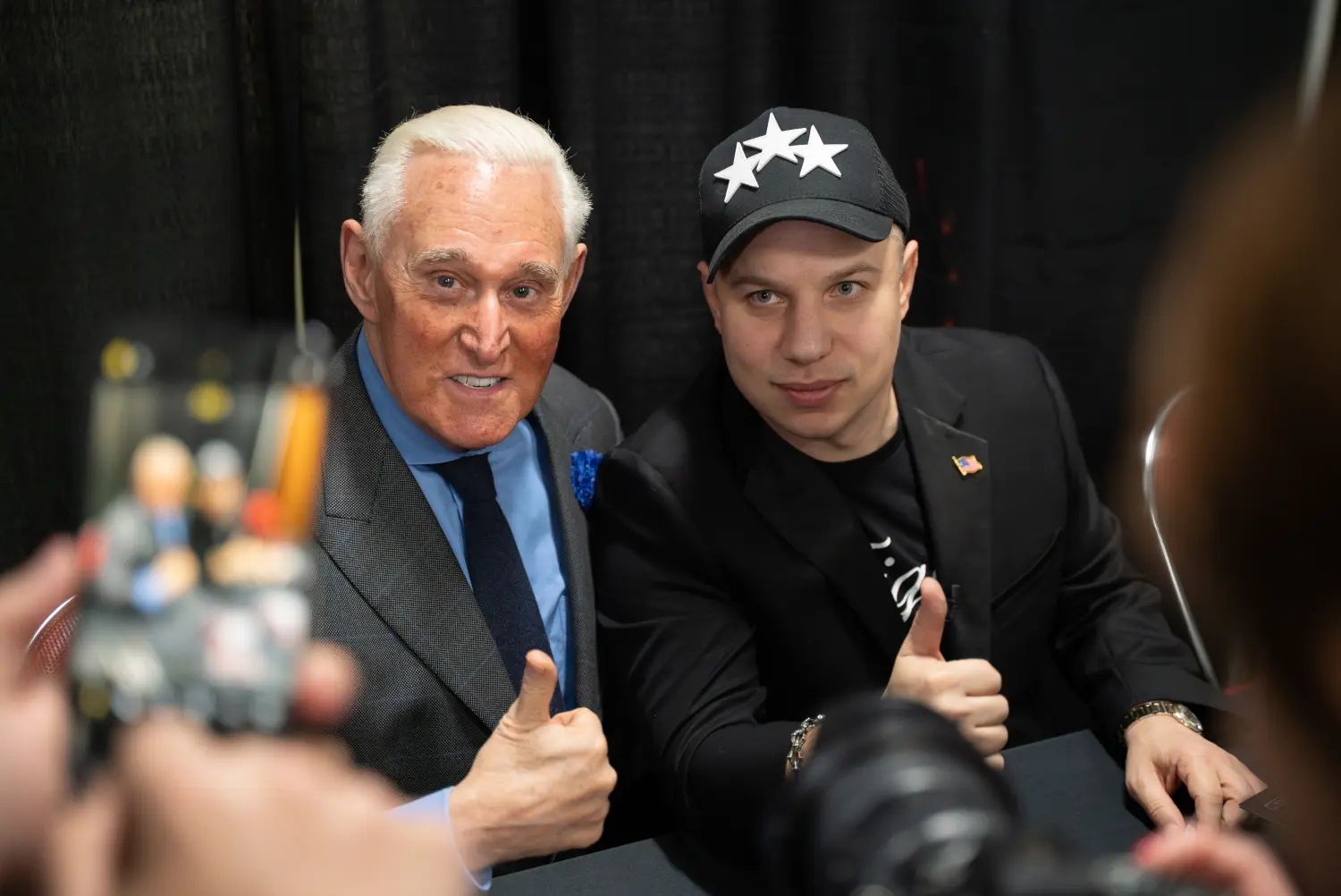 Constantino signing autographs with Roger Stone